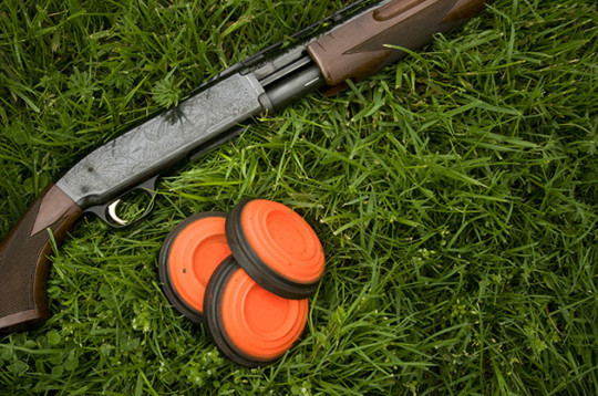 Shotgun and clay pigeons